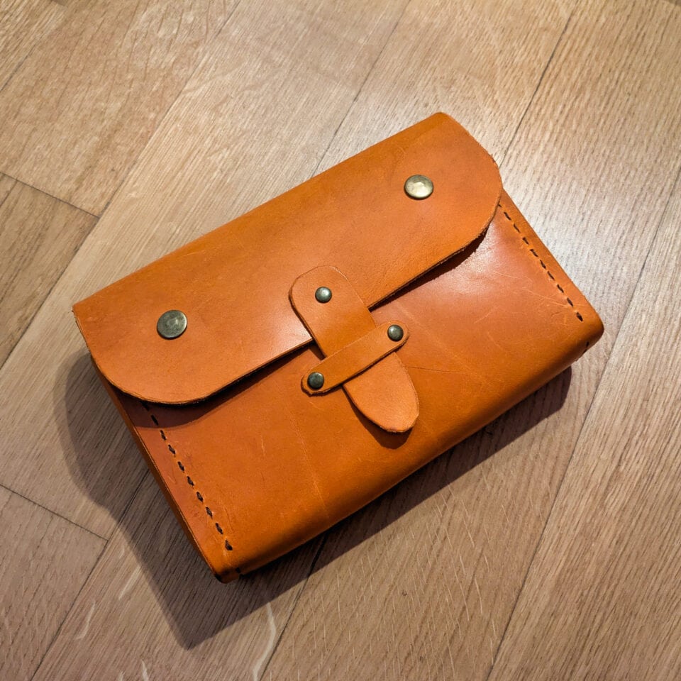 Carigiola borsetta in pelle colore cognac arancio